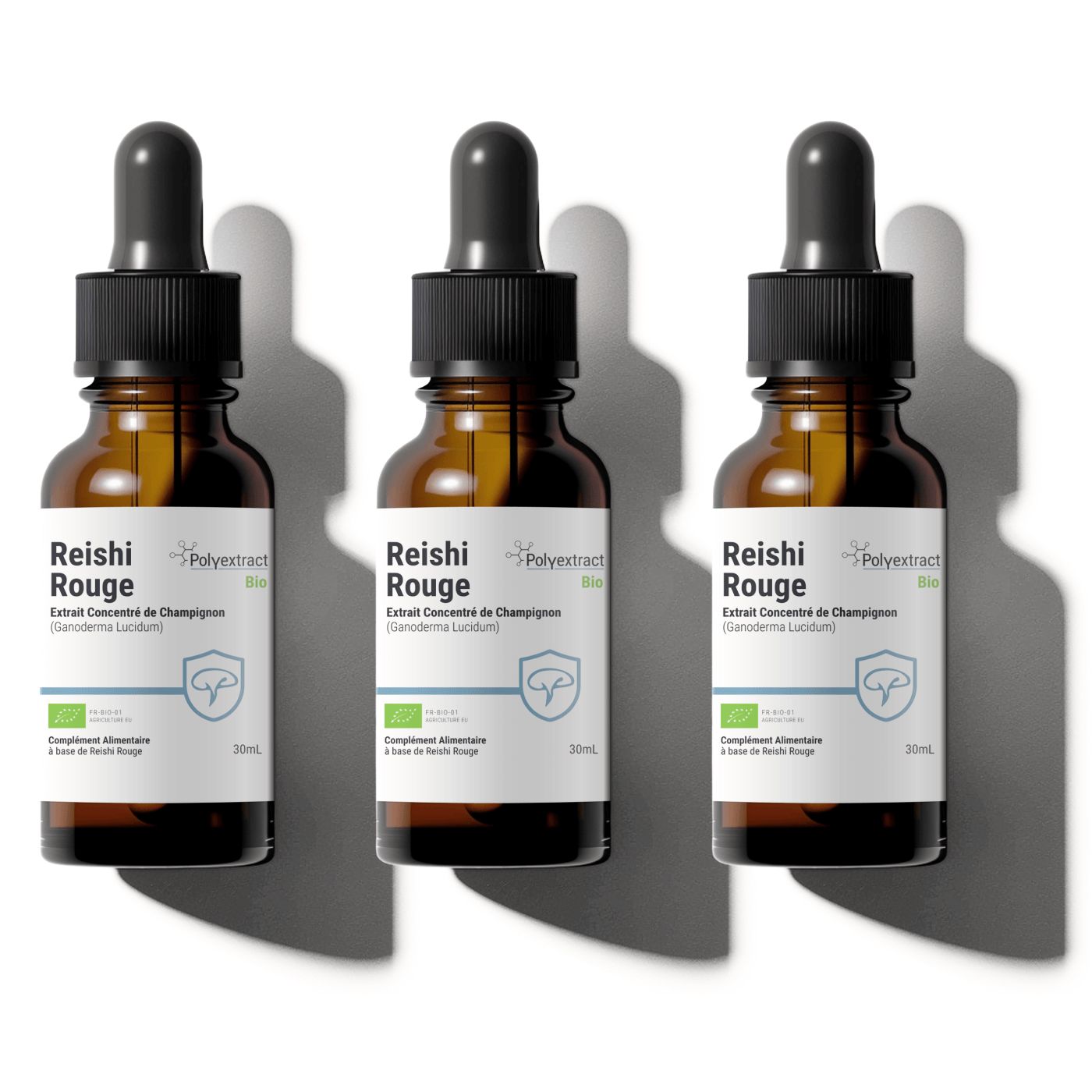 Three bottles of Reishi Rouge (red reishi) with dropper caps on a white background, food supplement brand is Polyextract