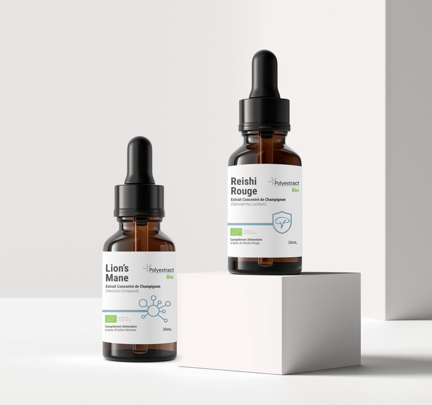 Two bottles of Reishi Rouge and Lion's Mane fungi extract from supplement brand Polyextract